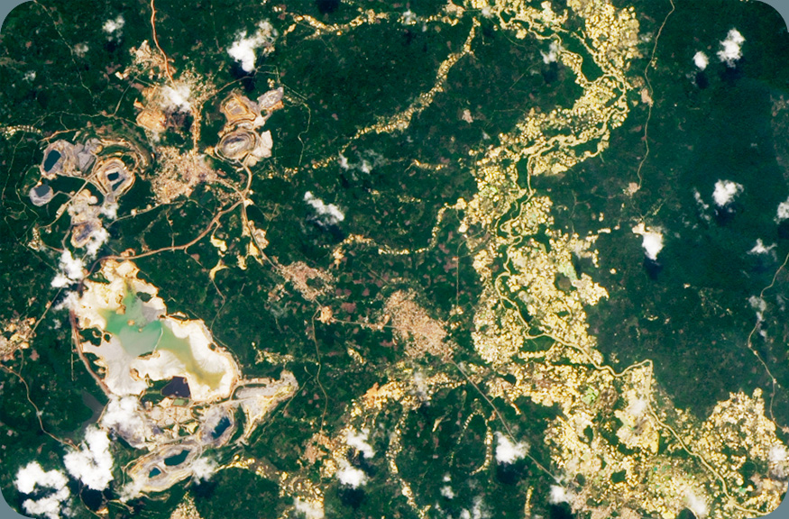 Satellite photo of an open pit mine and significant artisanal mining.